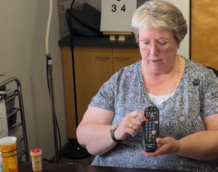 Amy Wurf demonstrating tactile labelling techniques using a television remote