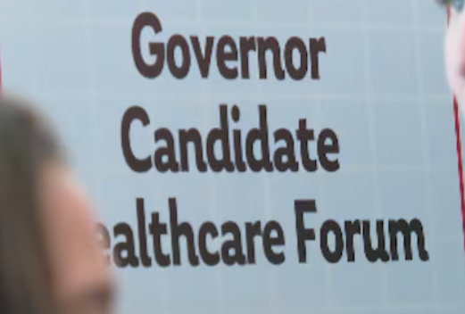 A portion of a sign reading Governor Candidate Healthcare Forum