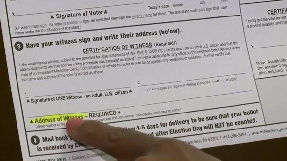 The witness signature and address lines on an absentee ballot envelope
