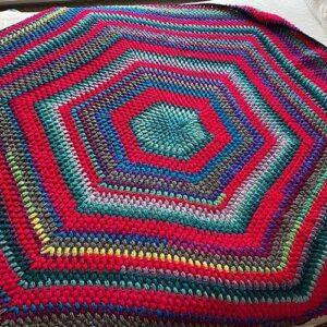 Multi-colored, hexagonal crocheted afghan using a puff stitch