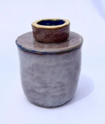 Light purple cylindrical pot with lid.