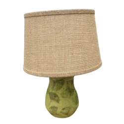 Green lamp with ginkgo leaf impressions and burlap shade