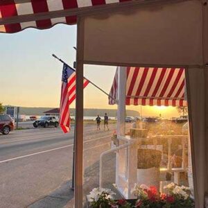Photograph of the entrance to an ice cream parlor across the street from the water