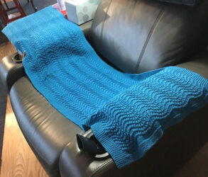 A blue knitted shawl