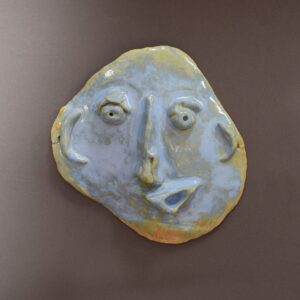 a mask out of blue clay