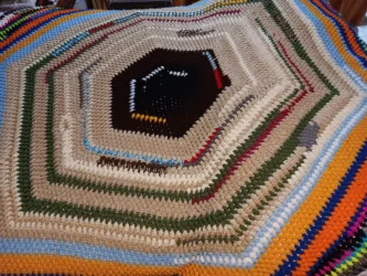 Hexagonal multi-color crochet afghan symbolically depicting characters and scenes from “Star Wars Episode IV—A New Hope.”